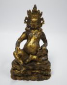 A Sino-Tibetan figure of Jambhala, 18.5cm high