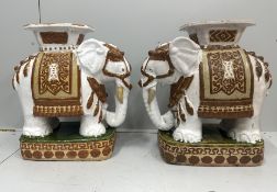 A pair of Chinese glazed earthenware elephant seats, height 50cm.