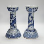 A pair of Chinese blue and white 'dragon' candlesticks, 28.5cm