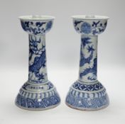 A pair of Chinese blue and white 'dragon' candlesticks, 28.5cm