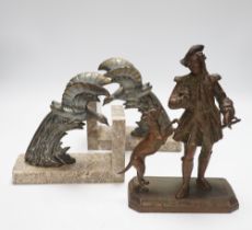 A pair of spelter eagle bookends and a figure with dog, figure 23cm high