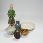 A Chinese Ming sancai figure, a similar cup, a 17th century blanc de chine dish, a blue and white
