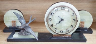 A French Art Deco green onyx clock garniture with Blue bird spelter mount, clock 46cm wide