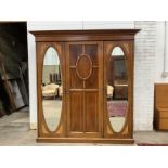 An Edwardian satinwood banded and patera inlaid mahogany triple compactum wardrobe, width 203cm,