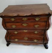 An 18th century Dutch walnut and fruitwood bombe four drawer chest, width 93cm, depth 51cm, height