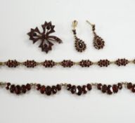 A late 19th/early 20th century Austro-Hungarian 900 gilt whit metal and garnet cluster set fringe