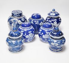 Seven Chinese blue and white Prunus decorated jars and covers, 19th/20th century, tallest 17cm high