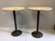 A pair of circular beech cast metal bar tables, diameter 74cm, height 105cm