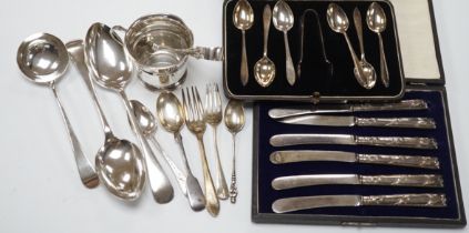 Two cased sets of silver flatware including teaspoons with tongs, nine assorted items of silver