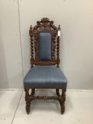 A Victorian Carolean style carved oak dining chair, height 112cm