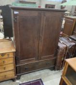 A late 18th century oak hanging cupboard, with later Art Nouveau hammered copper hinges, width