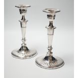 A pair of Edwardian silver candlesticks, with fluted oval bases, William Hutton & Sons Ltd,