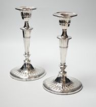 A pair of Edwardian silver candlesticks, with fluted oval bases, William Hutton & Sons Ltd,