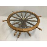 A circular oak coffee table modelled as a ship's wheel, diameter 96cm, height 41cm