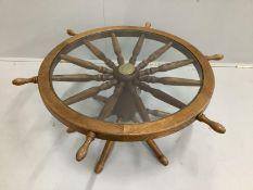 A circular oak coffee table modelled as a ship's wheel, diameter 96cm, height 41cm