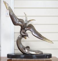 An Art Deco French patinated spelter figure of a bird in flight, signed Rochard to base, 60cm high