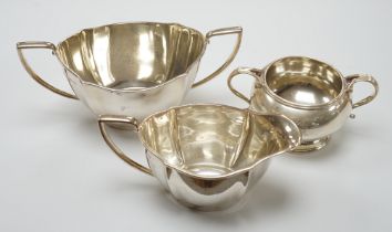 A George V silver sugar bowl and cream jug, Barker Brothers Silver Co, Birmingham, 1933 & 1937 and