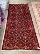 A Caucasian rug, 230cm x 104cm