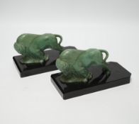 A pair of early 20th century green patinated spelter ‘bison’ book-ends, 19cm long