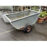 A vintage galvanised feed barrow, length 136cm, depth 64cm, height 72cm