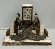 An Art Deco spelter and onyx peacock mantel clock, width 63cm, height 48cm