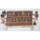 A framed textile possibly American Indian