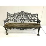 A Victorian black painted Coalbrookdale cast iron ivy pattern garden bench, length 147cm, depth