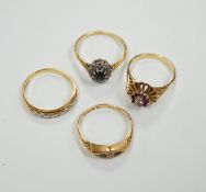 Four assorted Edwardian and later 18ct and gem set rings, including sapphire and diamond chip,