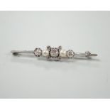 A white metal, diamond and cultured pearl cluster set bar brooch, 52mm, gross weight 6.2 grams.