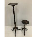 An early 20th century chinoiserie lacquer torchere and similar tripod wine table, larger height