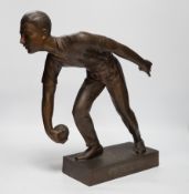 A bronzed spelter figure of a boule player, signed Fugere, 40cm high