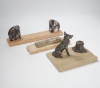 A marble and spelter Alsatian desk stand and two marble Art Deco photograph frames, largest 30cm