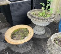 Two reconstituted stone and terracotta campana garden urns, larger diameter 55cm, height 46cm