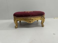 A Victorian carved giltwood footstool, width 36cm, height 16cm