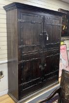 A pair of 16th century German or Netherlandish oak and wrought iron strapwork window shutters, later