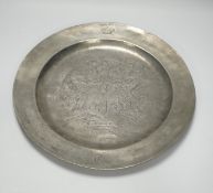 An 18th century pewter armorial charger, 38cm diameter