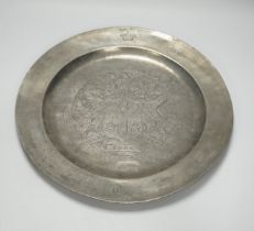 An 18th century pewter armorial charger, 38cm diameter