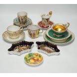 An Austrian chocolate cup and saucer, a similar trio, a BFB Worcester cup and saucer, a pair of