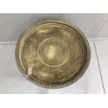 An Indian circular pierced brass tray top occasional table, diameter 69cm, height 65cm