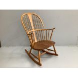 An Ercol elm and beech rocking armchair, width 66cm, depth 46cm, height 106cm