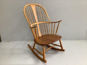 An Ercol elm and beech rocking armchair, width 66cm, depth 46cm, height 106cm