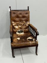 An early Victorian turned mahogany library chair with distressed leather cushion seat and back,