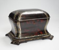 A Victorian papier mache tea caddy, stamped Jennens and Bettridge, in the form of a sarcophagus with