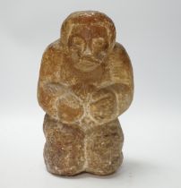 A soapstone Inuit carved figure, 22cm high