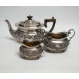 A matched late Victorian silver three piece tea set, maker's Haseler Brothers and John Round & Son
