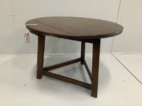 A 19th century and later circular oak and fruitwood cricket table, reduced, diameter 72cm, height