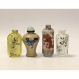 A Chinese crackle glaze snuff bottle, two inside painted glass snuff bottles and an underglaze