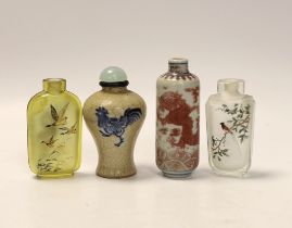 A Chinese crackle glaze snuff bottle, two inside painted glass snuff bottles and an underglaze