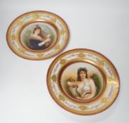 A pair of early 20th century Schwarzburg cabinet plates, a mason and a harpist, 26cm