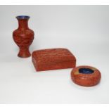 Three Chinese cinnabar lacquer items, a vase, an ashtray and a lidded box, vase 16.5cm